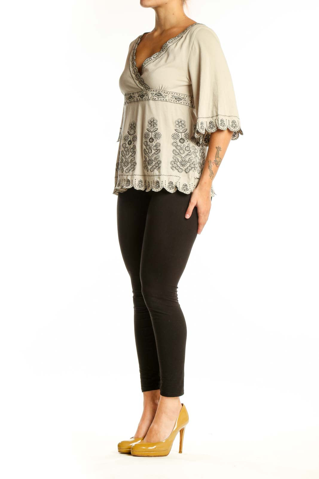 Cream embroidered cotton V-neck top with floral details and bell sleeves by BCBG MaxAzria