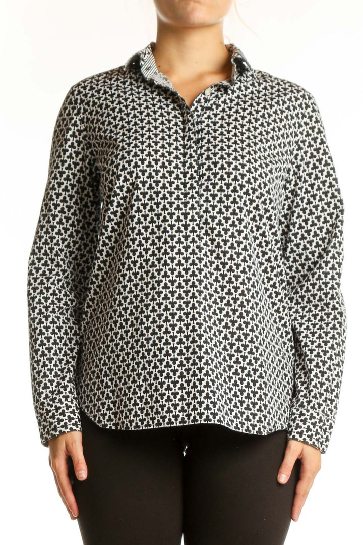 Black and white geometric print button-up shirt with collar and long sleeves, front view