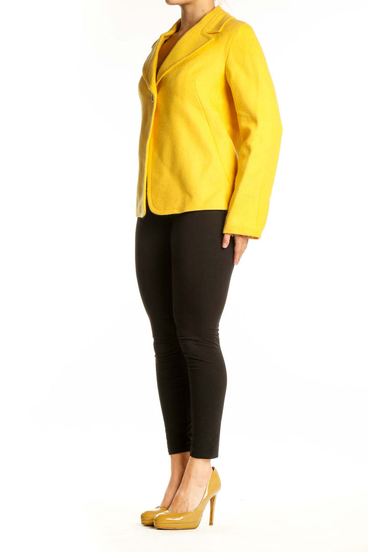 Front view of yellow tailored blazer with single button closure and notched lapels