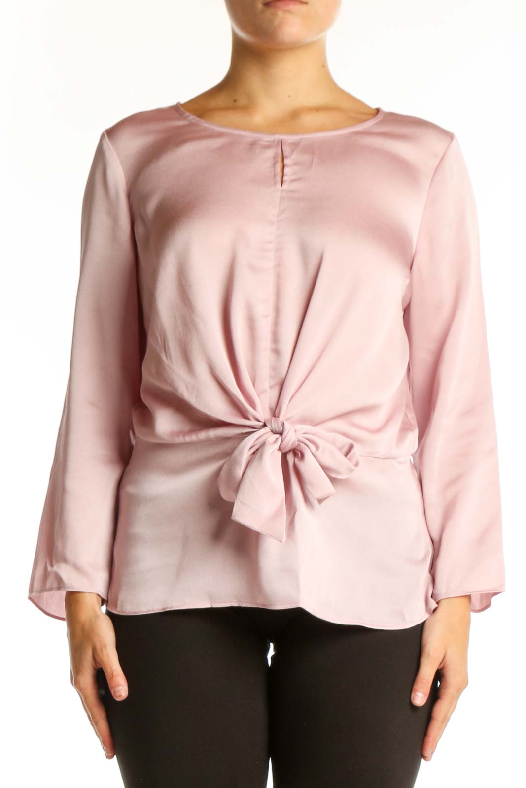 Pink tie-front long sleeve blouse with crew neckline, front view on model