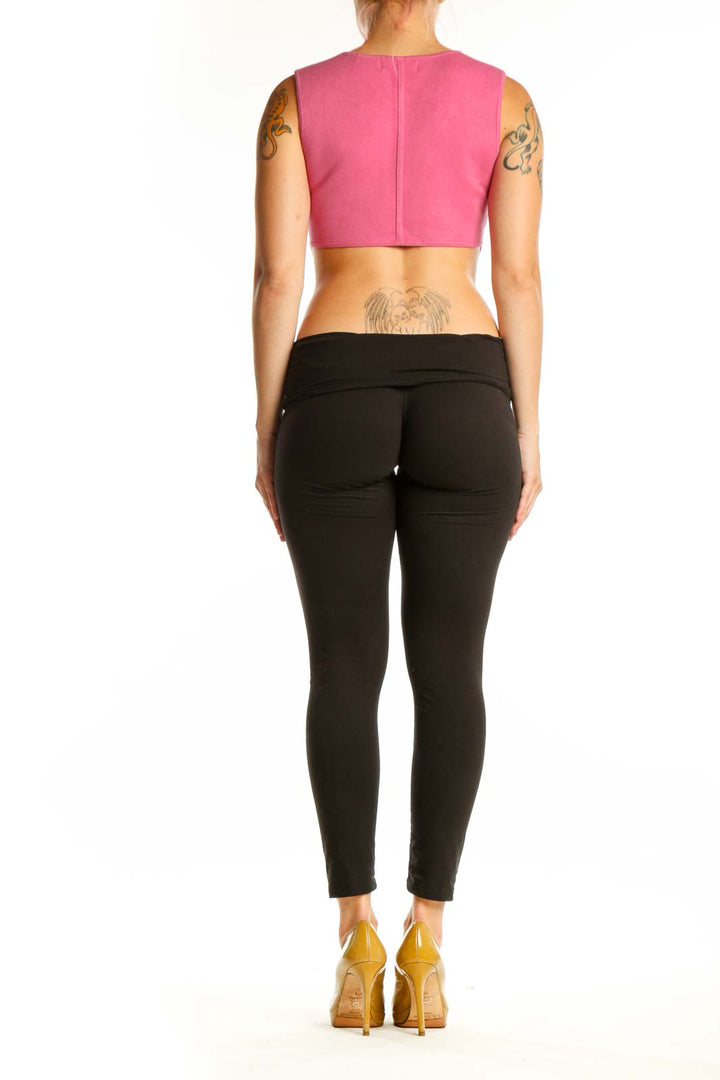 Pink cropped sleeveless knit tank top from House of Harlow 1960, back view on model