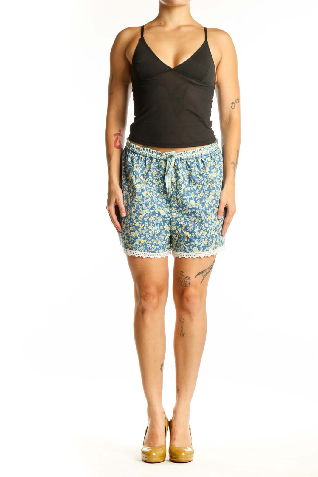 Blue floral shorts with yellow flowers and cream lace trim, featuring drawstring waistband and relaxed fit