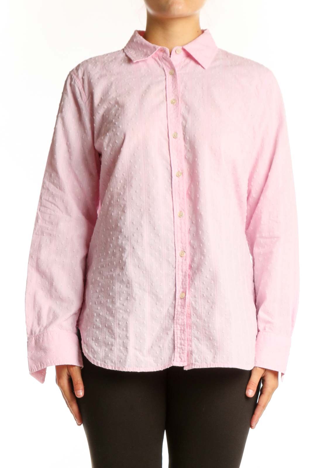 Pink cotton button-down shirt with collared neckline and long sleeves, displayed on model