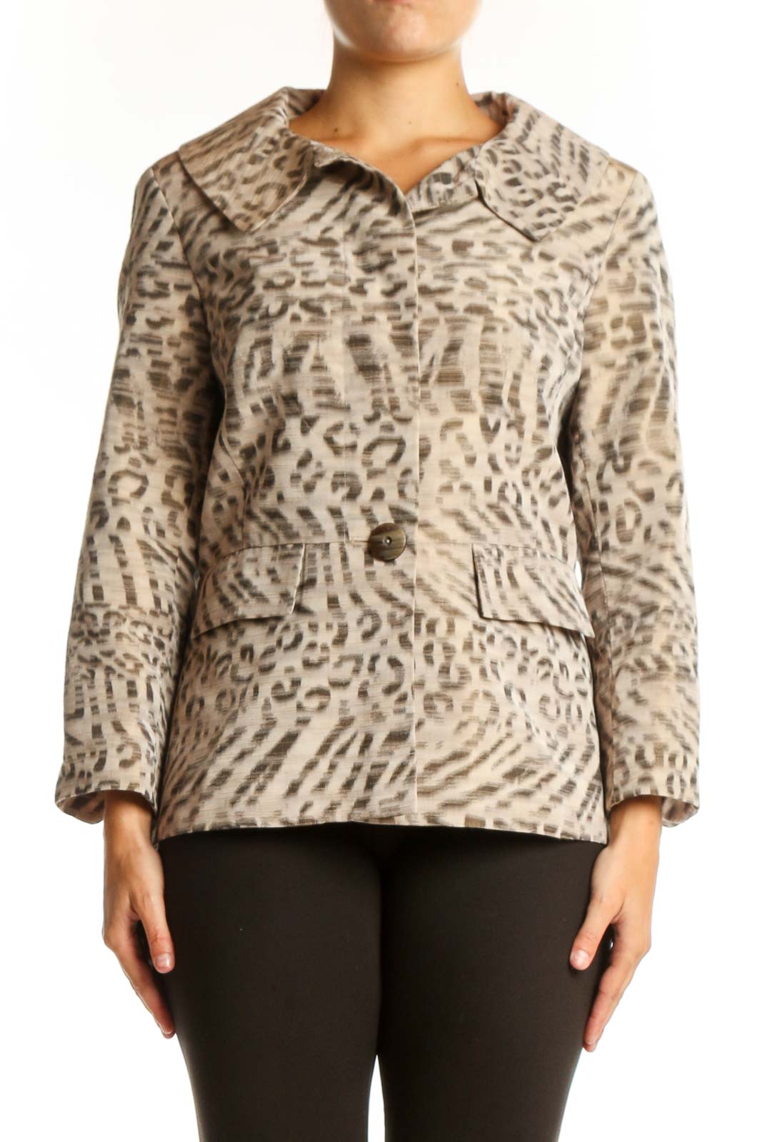 Beige leopard print button-up jacket with collared neckline and tailored waist, worn with black pants