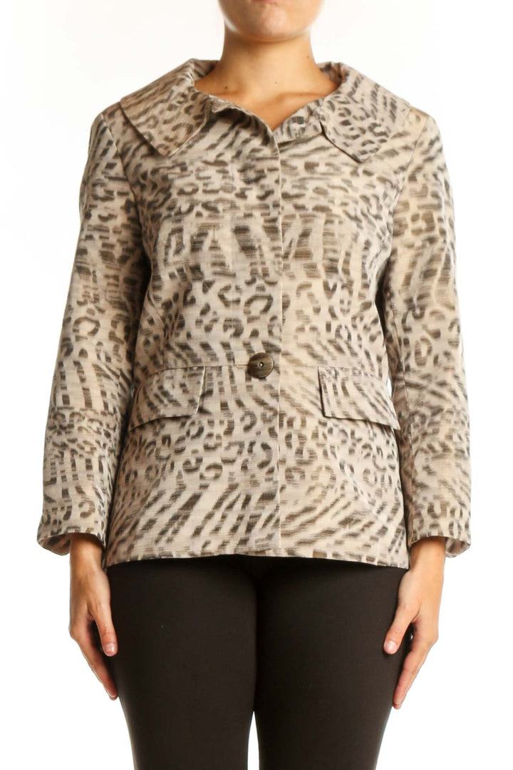 Beige leopard print button-up jacket with collared neckline and tailored waist, worn with black pants