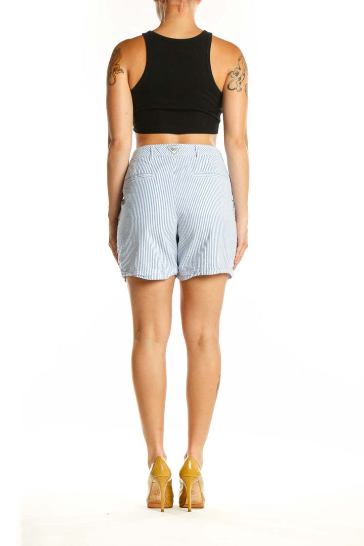 Back view of blue and white striped cotton shorts by Columbia with functional pockets