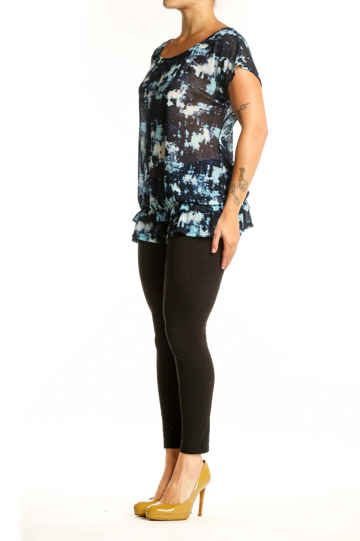 Navy abstract print short sleeve top with white and blue tie-dye pattern, front view on model