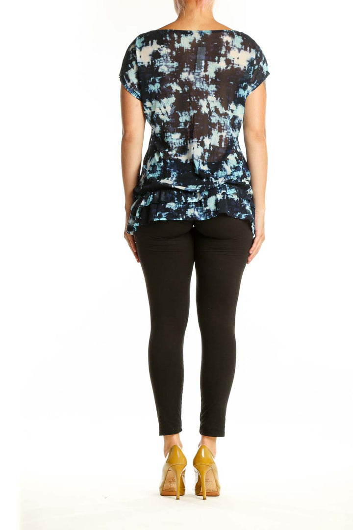 Navy abstract print short sleeve top back view, showing relaxed fit and pattern detail