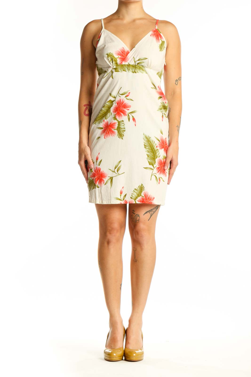 SilkRoll cream cotton wrap dress with red and green floral print, front view showing V-neckline and spaghetti straps
