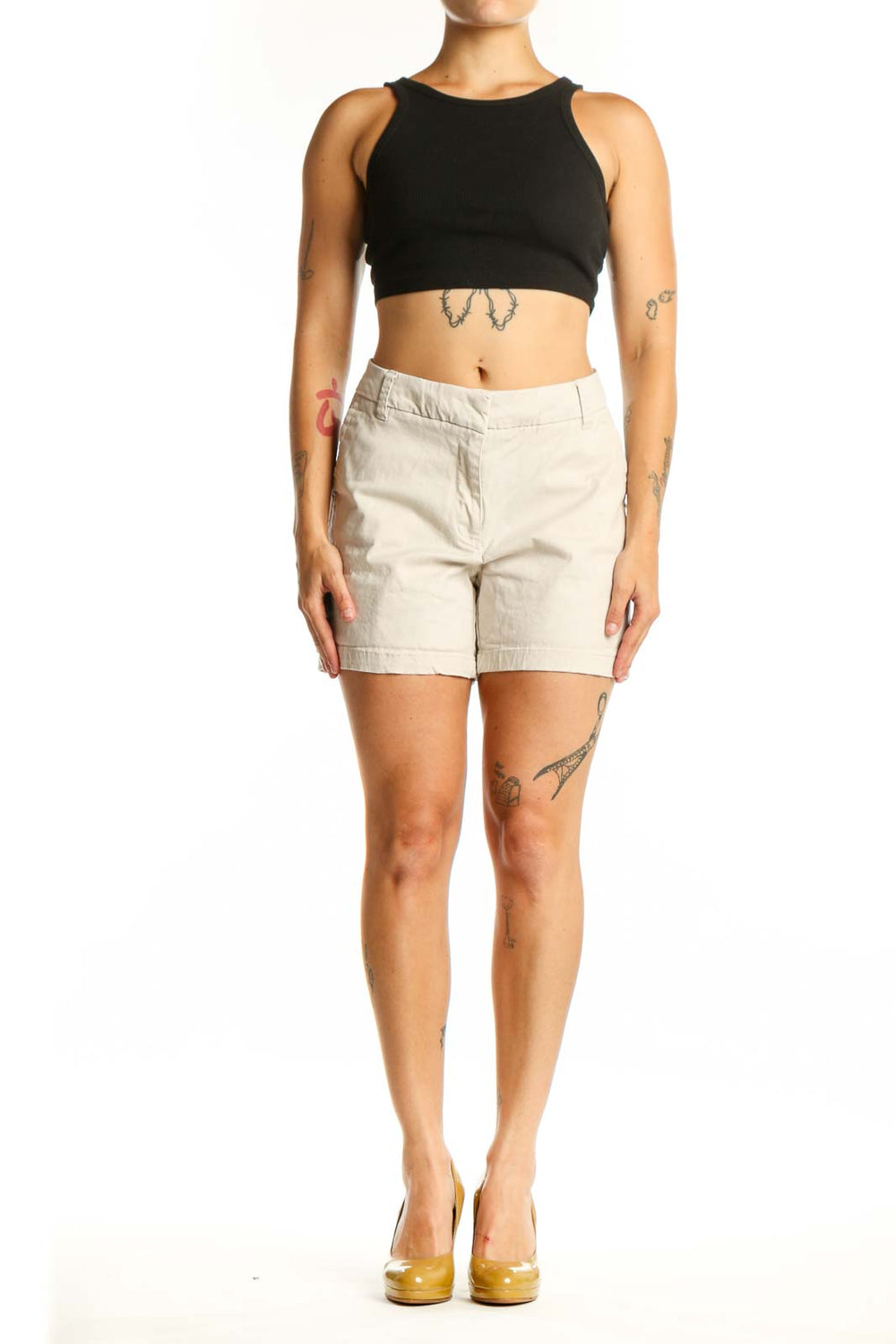 Front view of cream cotton-spandex blend shorts with zip fly closure and five-pocket design