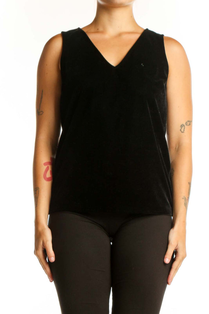 Black velvet sleeveless V-neck top by J.Crew, front view on model