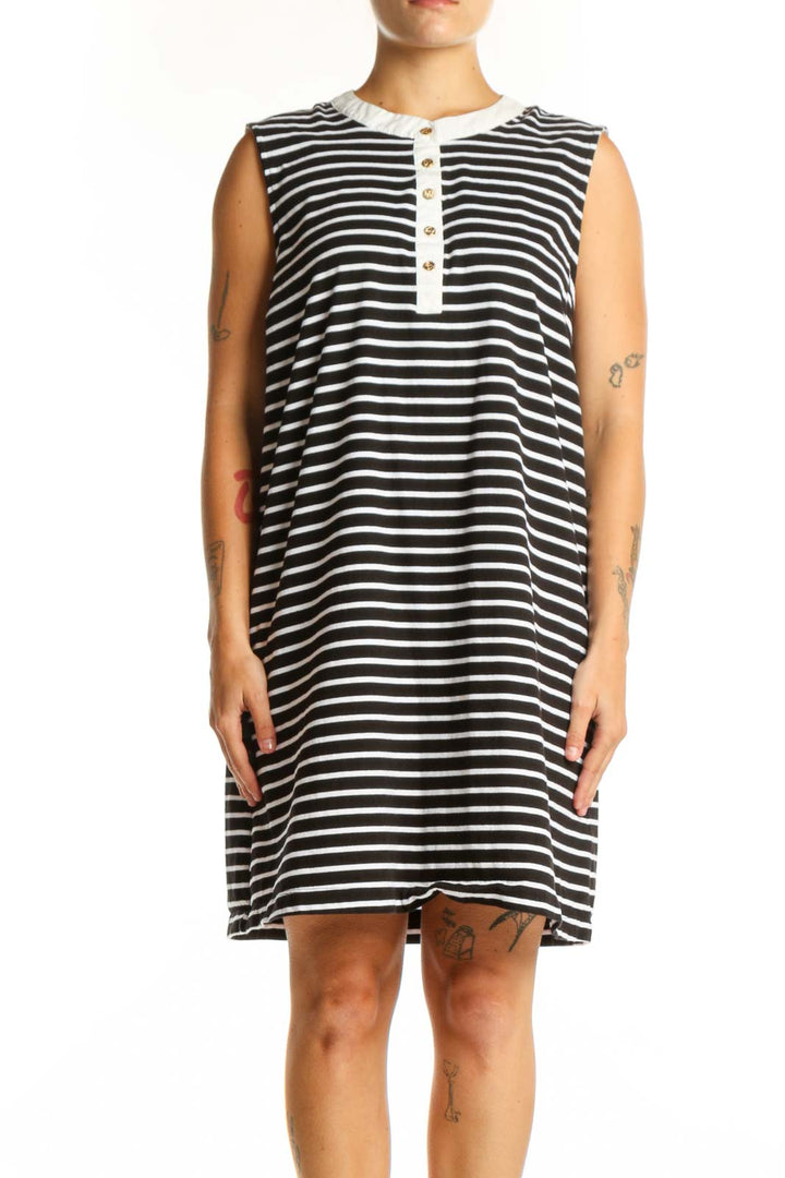 Black and white horizontal striped sleeveless cotton dress with white button placket detail, front view