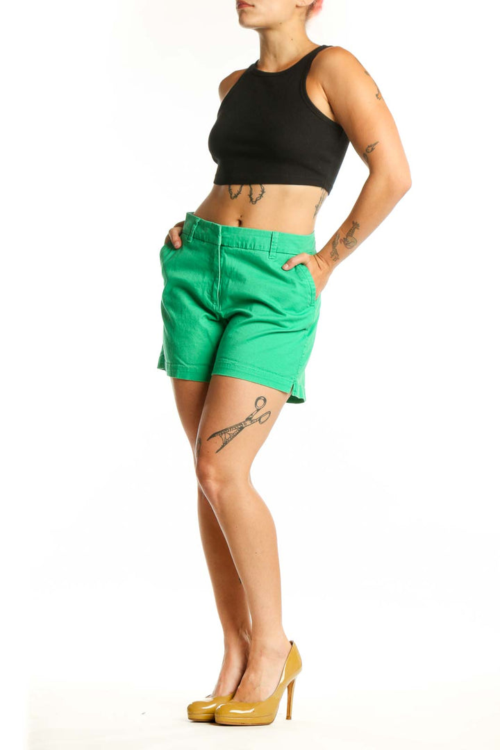 Front view of vibrant green cotton-spandex shorts by Crown & Ivy, size L, featuring classic waistband and mid-thigh length