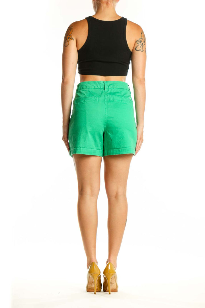 Back view of green shorts by Crown & Ivy showing rear pockets and flattering fit on size L