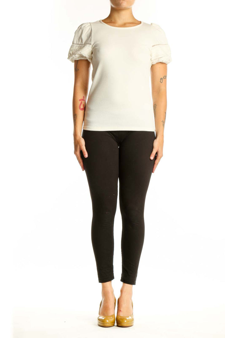 Cream puff sleeve J.Crew top front view on model, showing crew neckline and ruched short sleeves