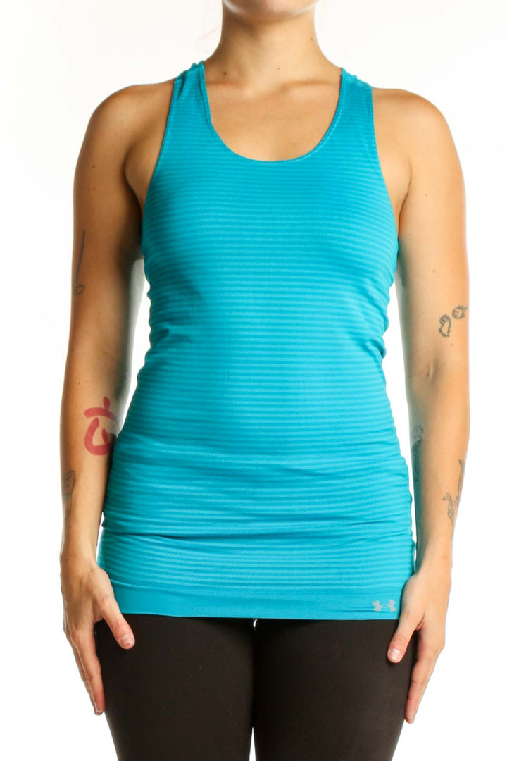 Woman wearing turquoise striped Under Armour racerback athletic tank with horizontal ribbed texture, front view
