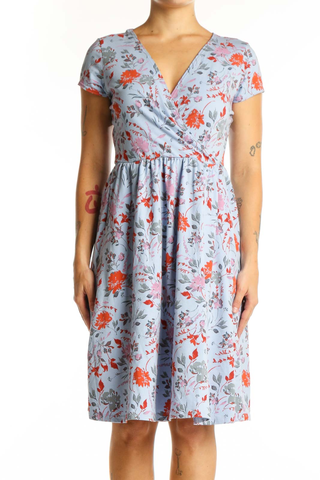 Blue floral wrap dress with orange and pink blooms, short sleeves, and gathered waist - front view