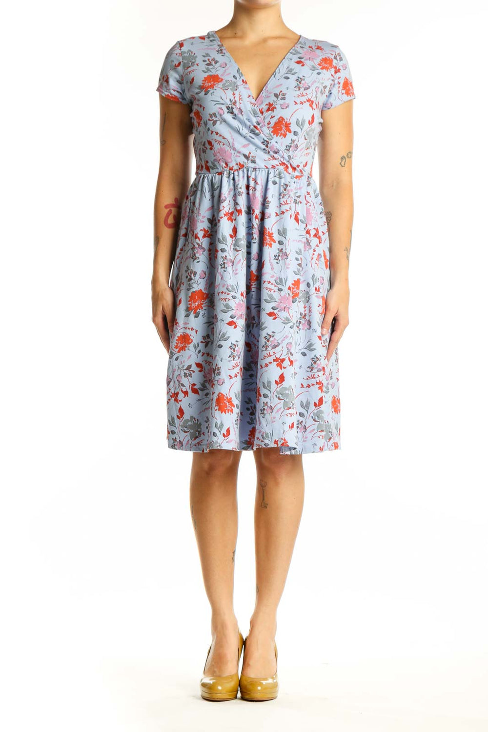 Blue floral wrap dress with orange and pink blooms, short sleeves, and gathered waist - front view
