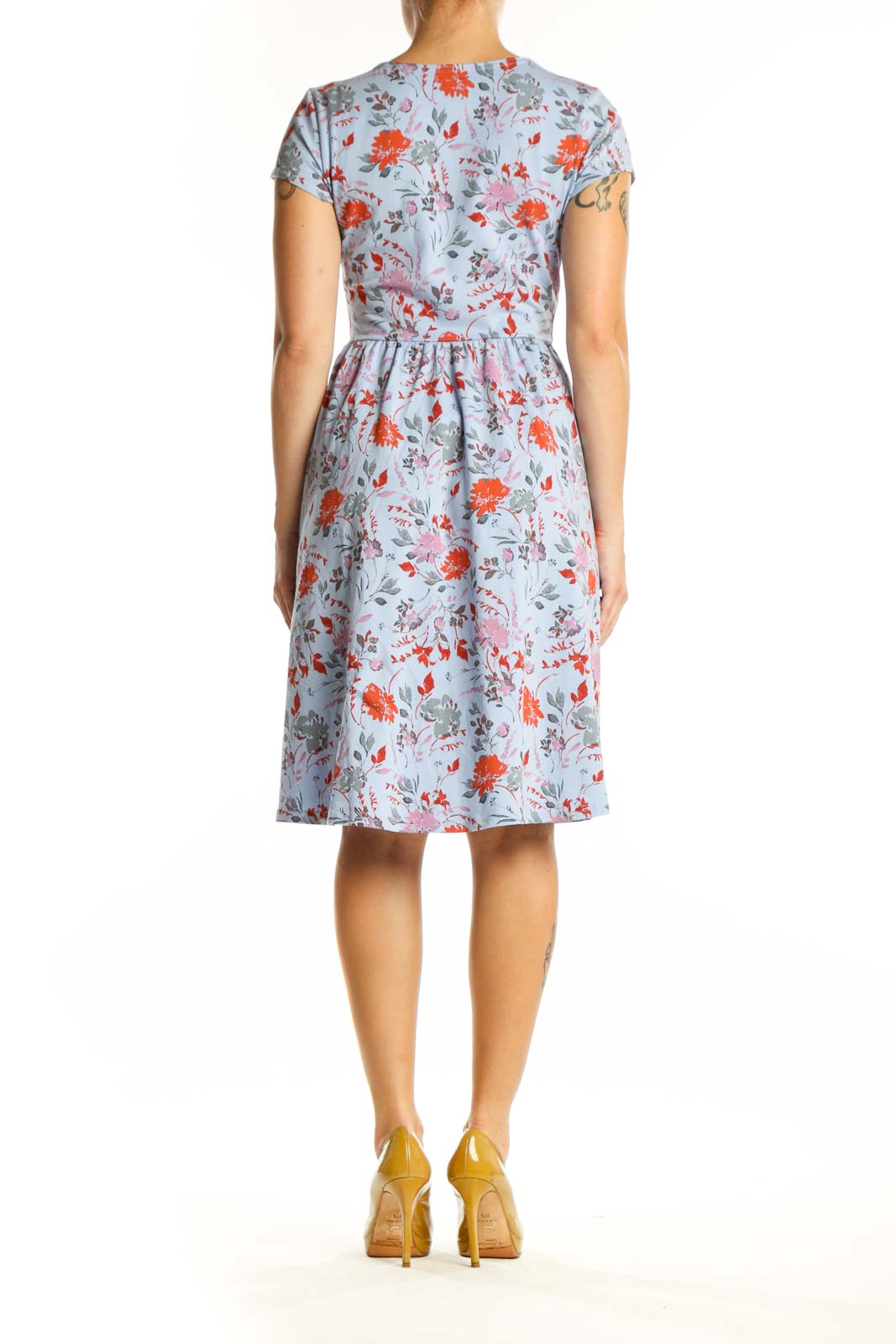 Blue floral wrap dress back view showing A-line skirt and wrap-style design