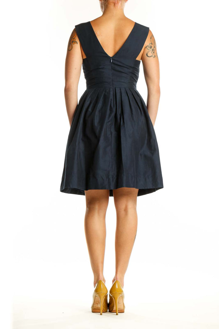 Navy V-Neck Fit and Flare Dress back view, displaying elegant sleeveless design and A-line skirt