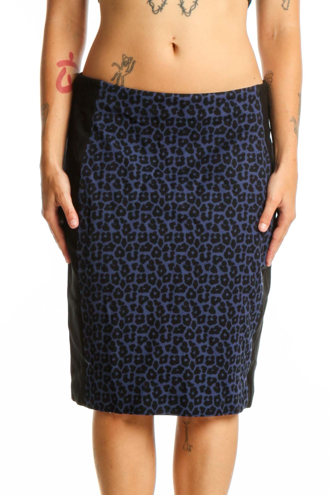 Navy leopard print pencil skirt front view, showcasing bold animal print pattern and flattering silhouette