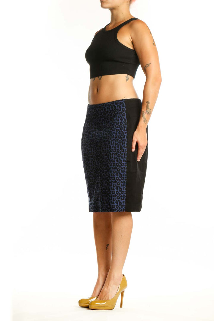 Navy leopard print pencil skirt front view, showcasing bold animal print pattern and flattering silhouette