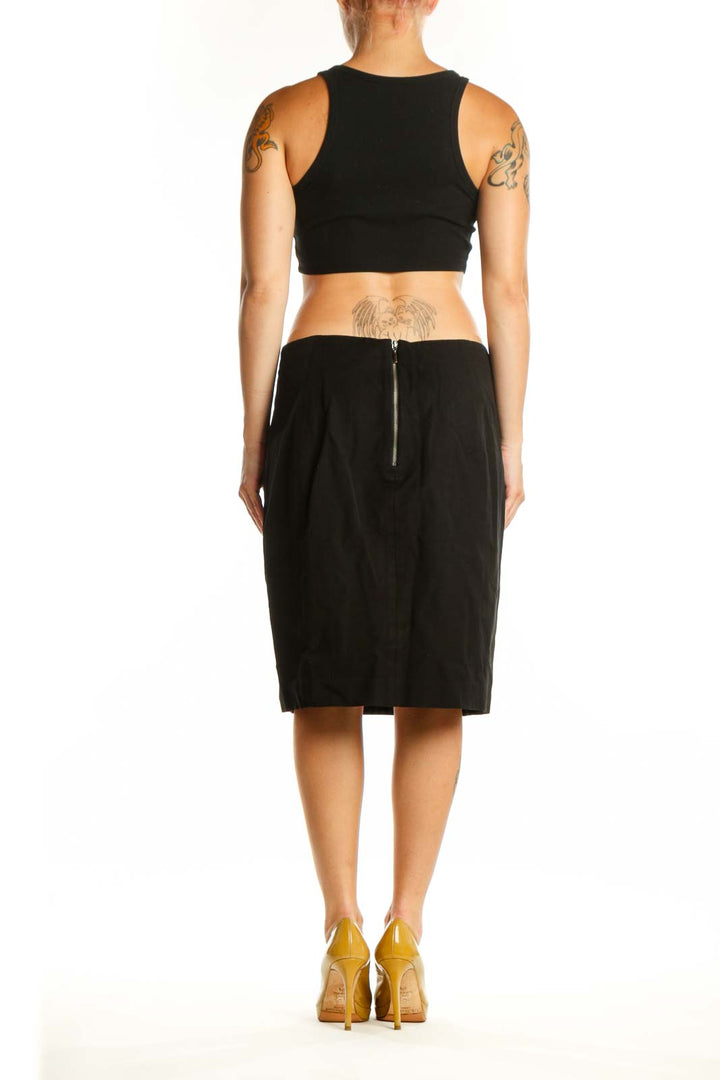 Navy leopard print pencil skirt back view, displaying sleek pencil cut and professional knee-length design