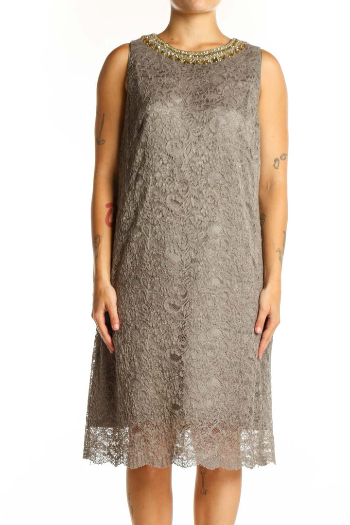 Gray lace cocktail dress with gold beaded neckline, sleeveless design, and lace hem detail