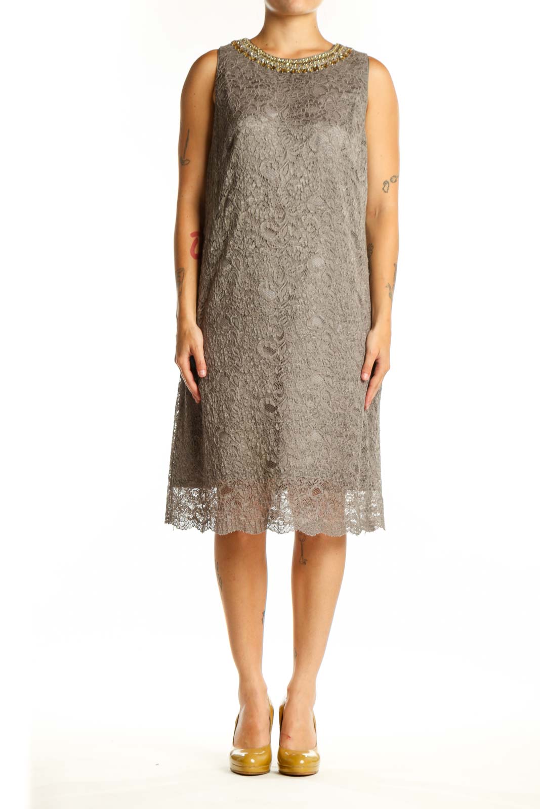 Gray lace cocktail dress with gold beaded neckline, sleeveless design, and lace hem detail