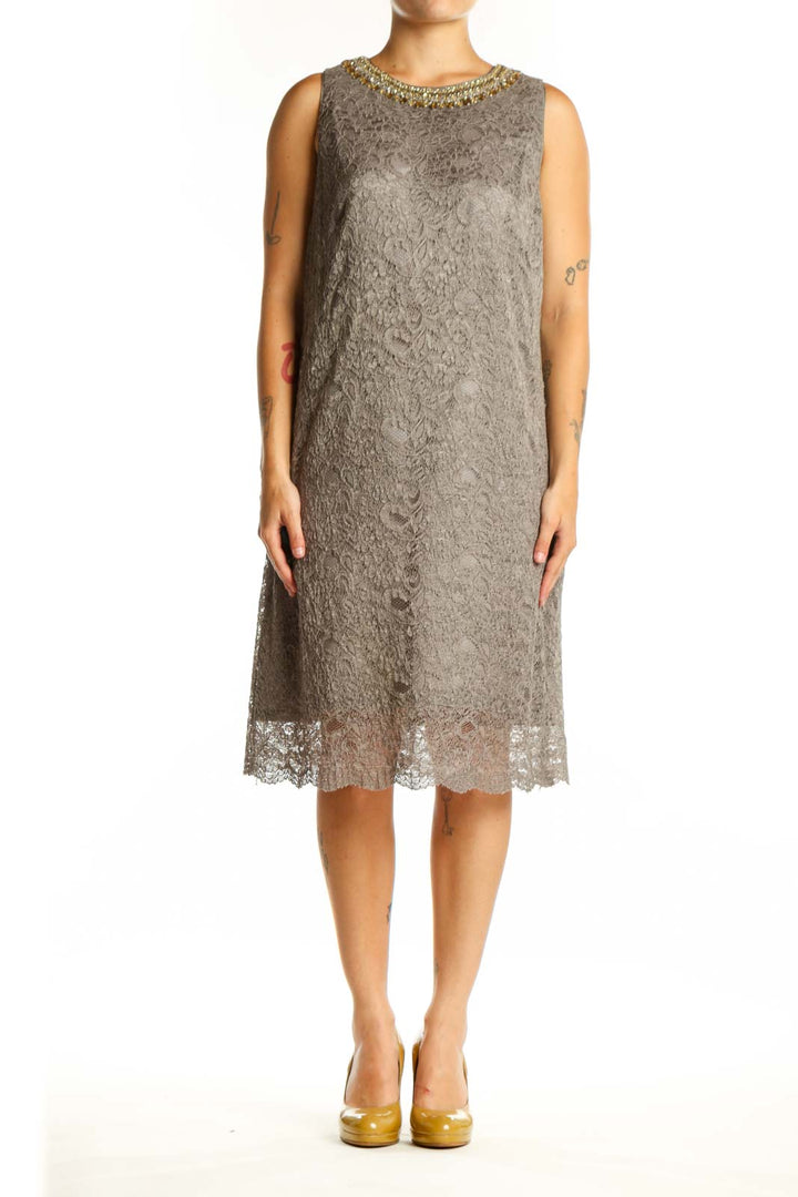 Gray lace cocktail dress with gold beaded neckline, sleeveless design, and lace hem detail