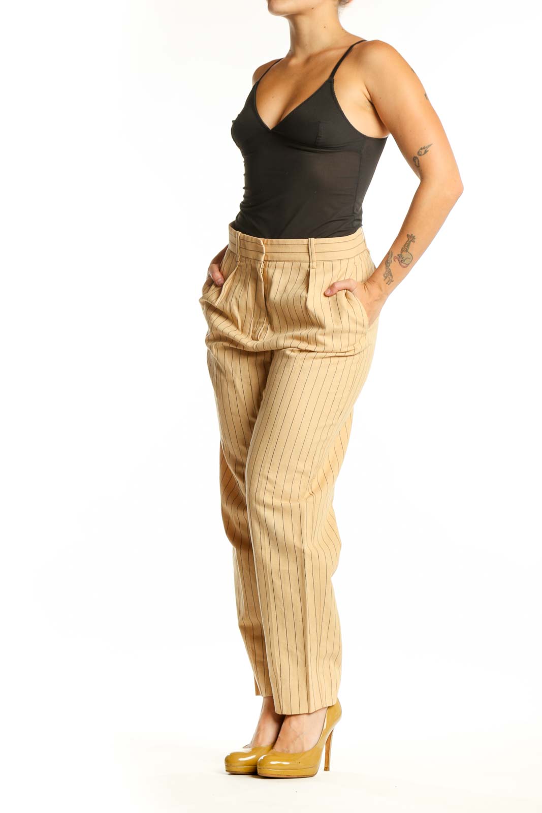 Front view of cream pinstriped Maje pleated trousers with high-waisted design and straight-leg cut