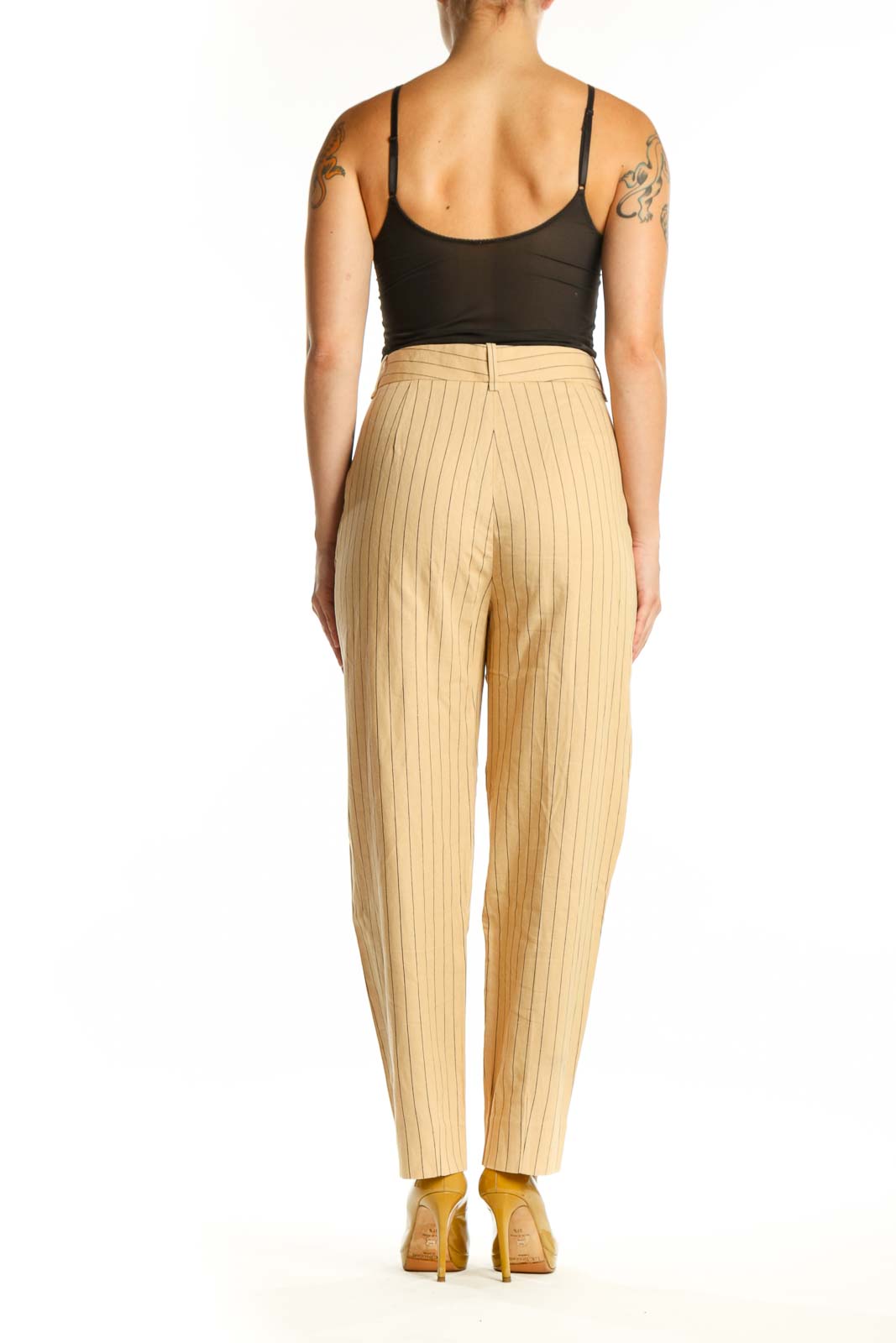 Back view of cream pinstriped Maje trousers showing pleated detailing and tailored silhouette