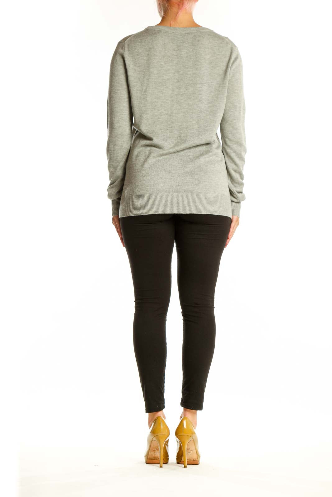 Back view of beige knit pullover sweater showing clean silhouette and relaxed fit