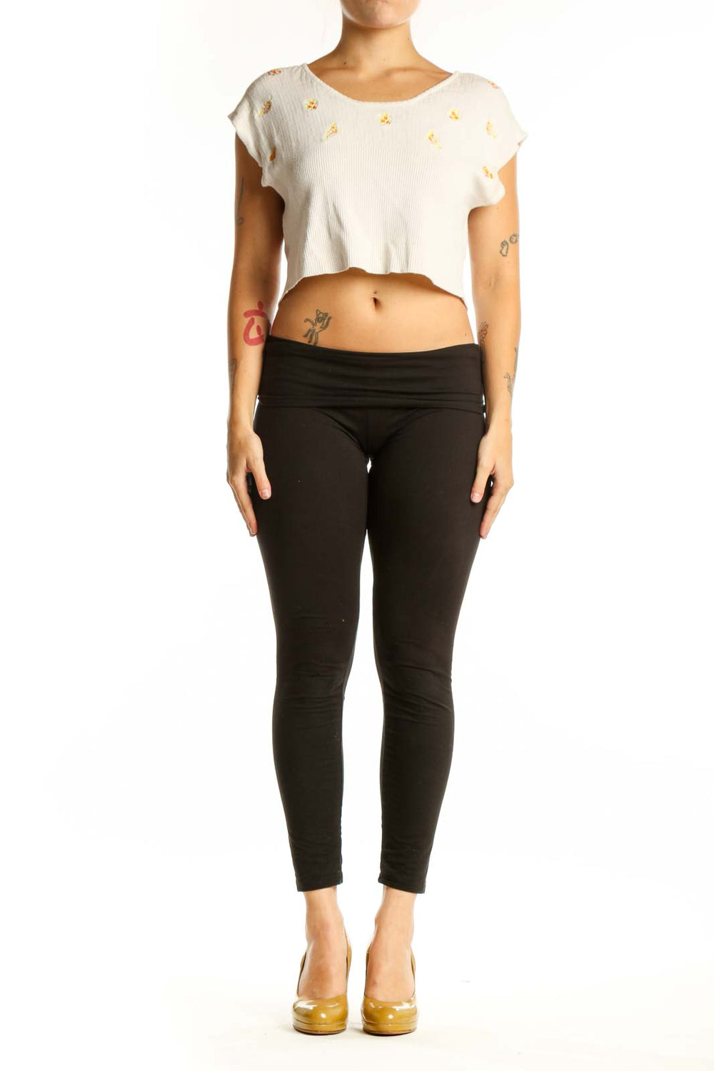 Cream ribbed crop top with gold floral embroidery, short cap sleeves, front view