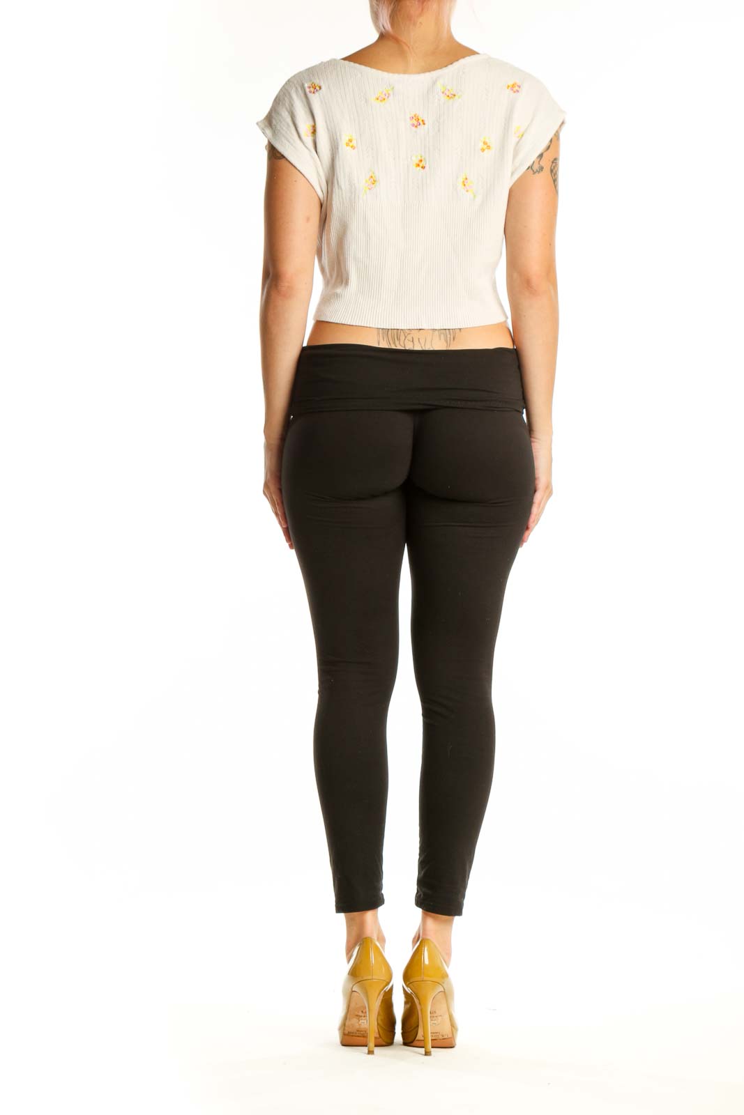 Cream ribbed crop top with gold floral embroidery, short cap sleeves, back view