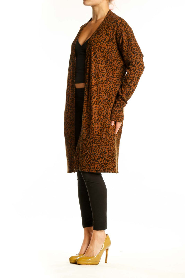 Brown leopard print knit cardigan by Sanctuary worn open over black crop top, front view