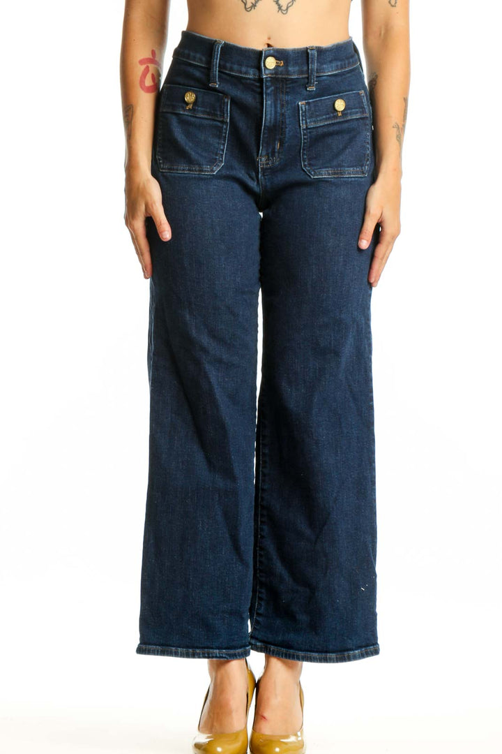 Front view of dark blue wide-leg J.Crew jeans with functional front pockets and brass button details