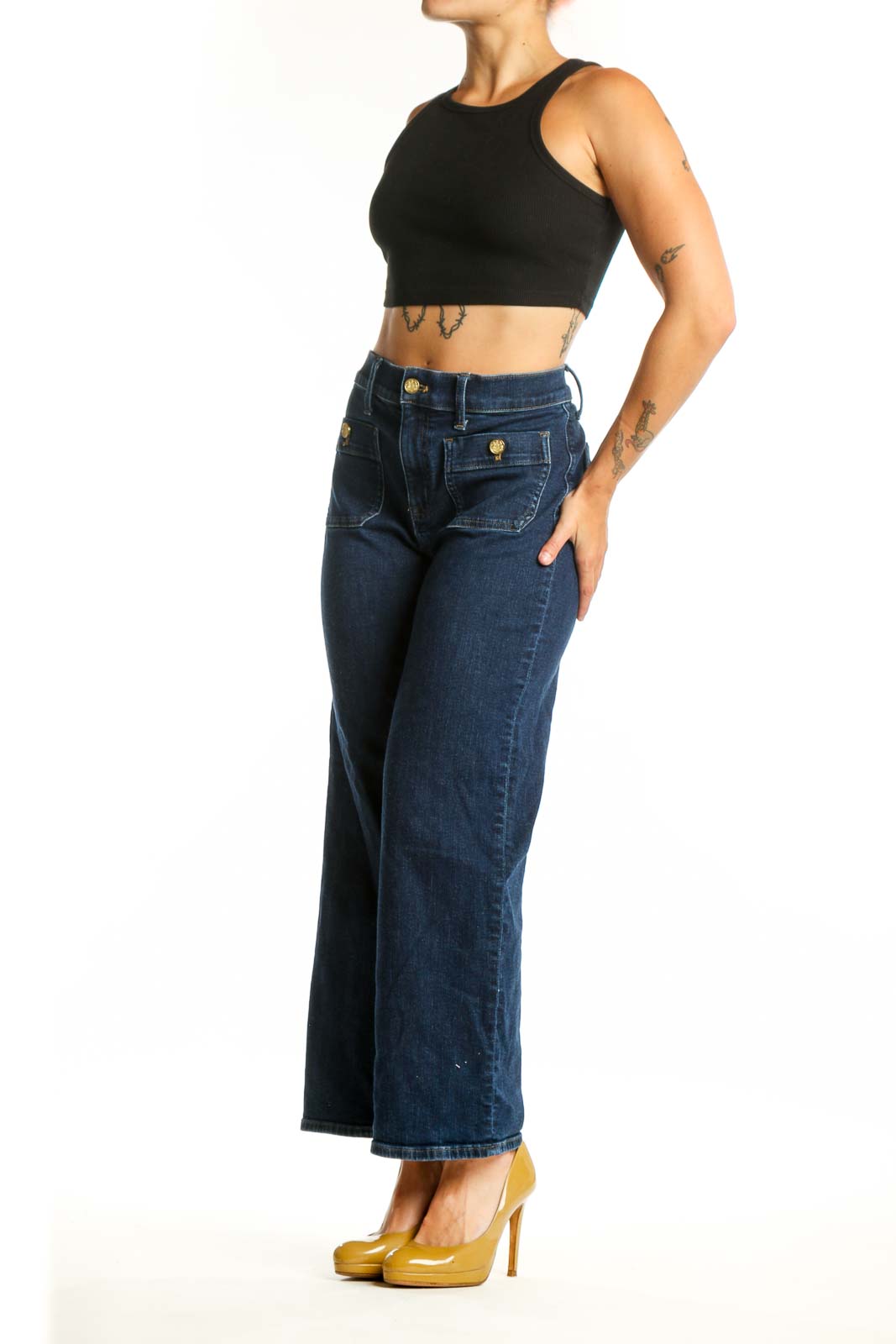 Front view of dark blue wide-leg J.Crew jeans with functional front pockets and brass button details