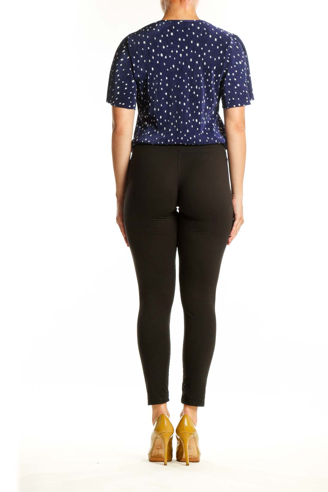 Navy polka dot wrap top with flutter sleeves, back view on model