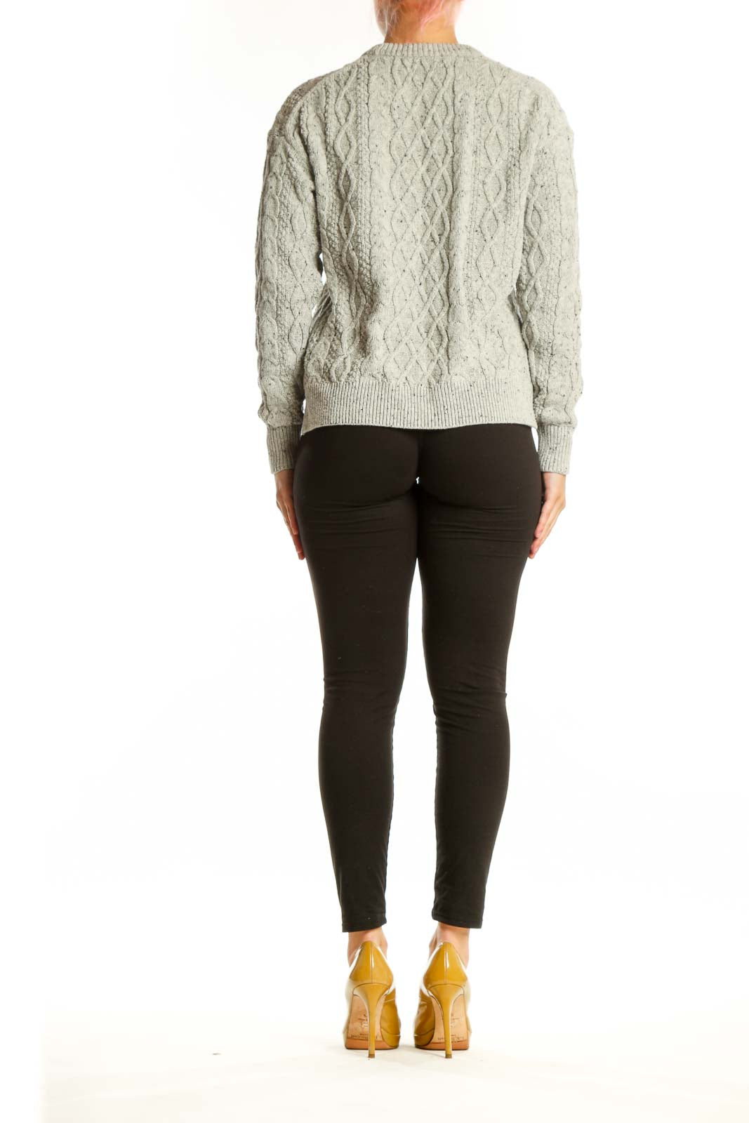 Back view of cream cable knit pullover sweater showing textured diamond knit pattern and cropped silhouette