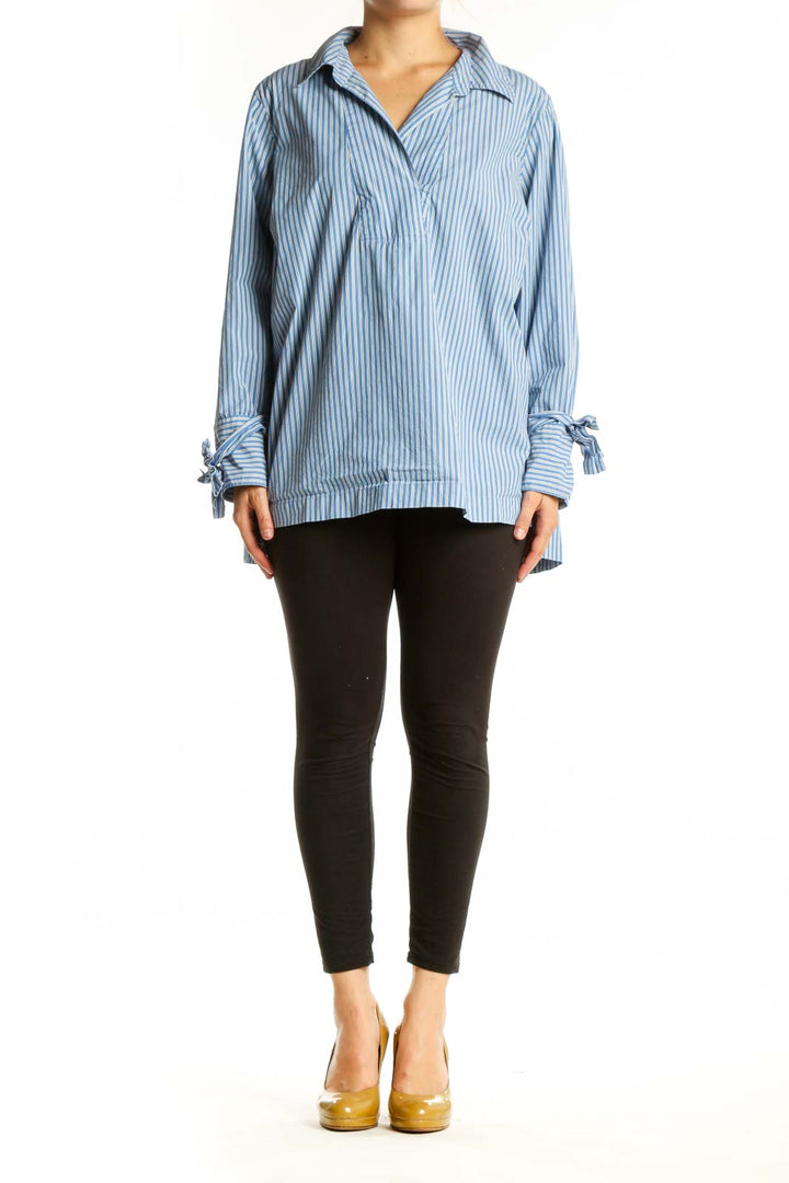 Blue and white striped pullover top with collared neckline and tie-cuff sleeves, front view