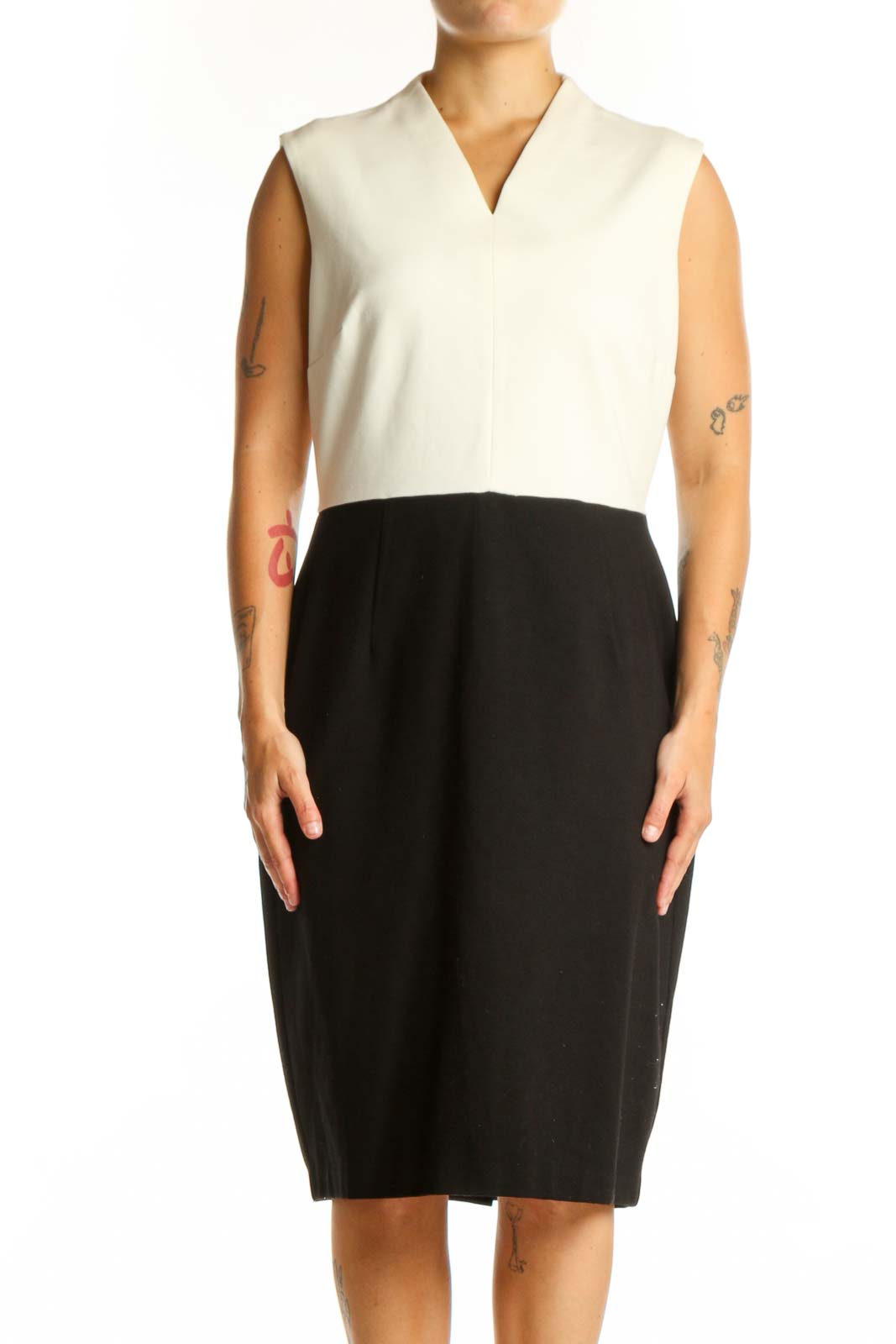 Front view of cream and black colorblock sleeveless dress with V-neckline and midi length