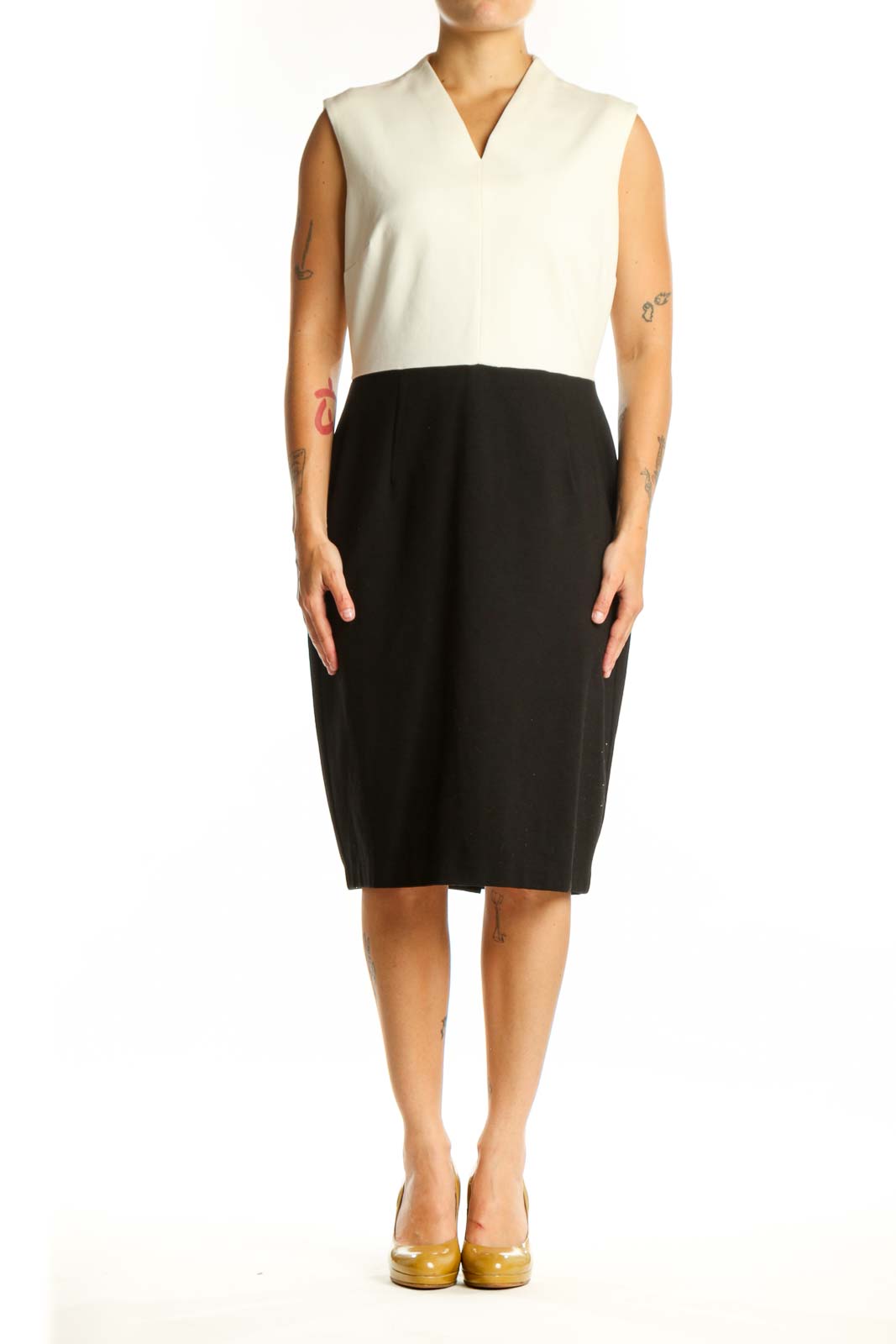 Front view of cream and black colorblock sleeveless dress with V-neckline and midi length