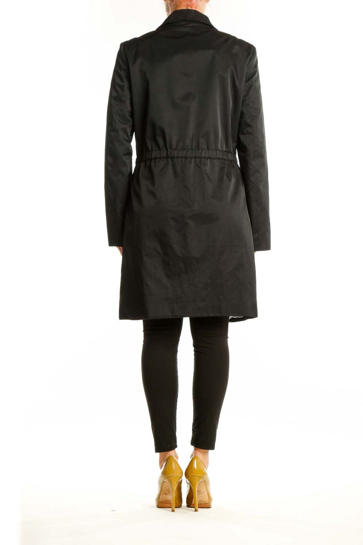 Black Calvin Klein windbreaker coat back view showing sleek silhouette and functional design details