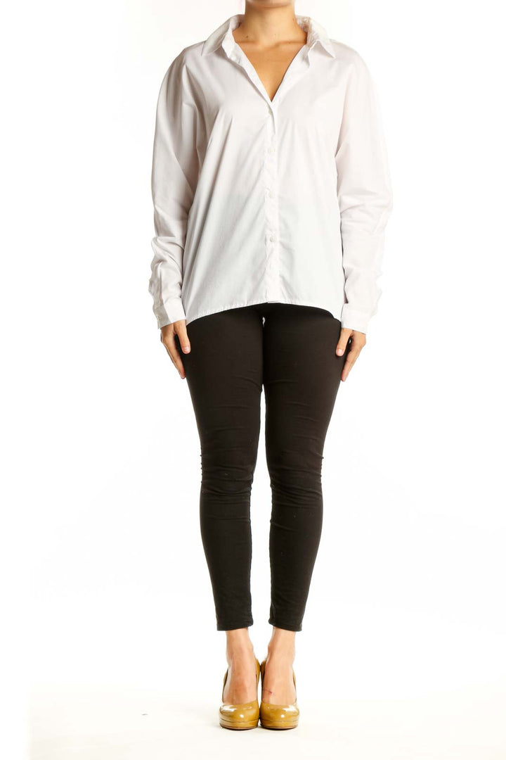 White button-up collared shirt with long sleeves, front view on model