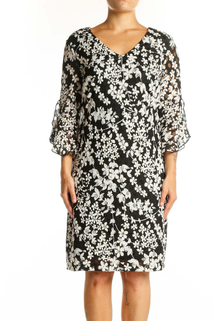 Black and white floral print dress with three-quarter sleeves and V-neckline, front view