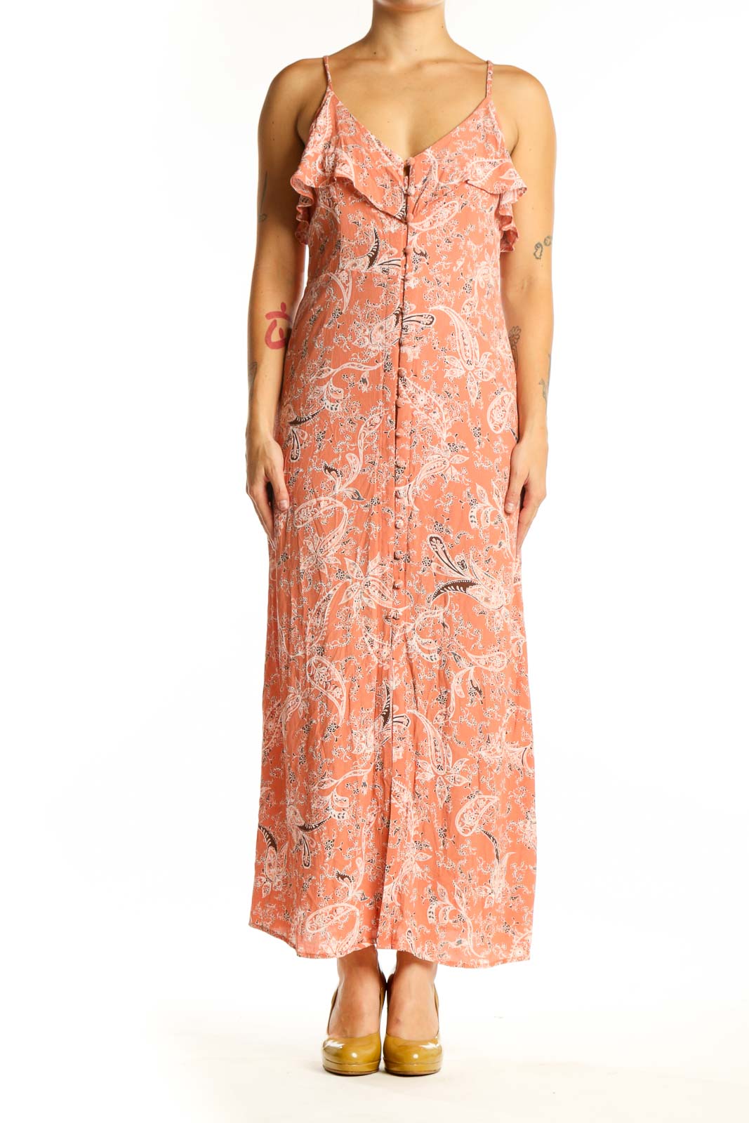 Coral floral maxi dress with ruffled cold-shoulder neckline and button-front closure, displayed on model from front