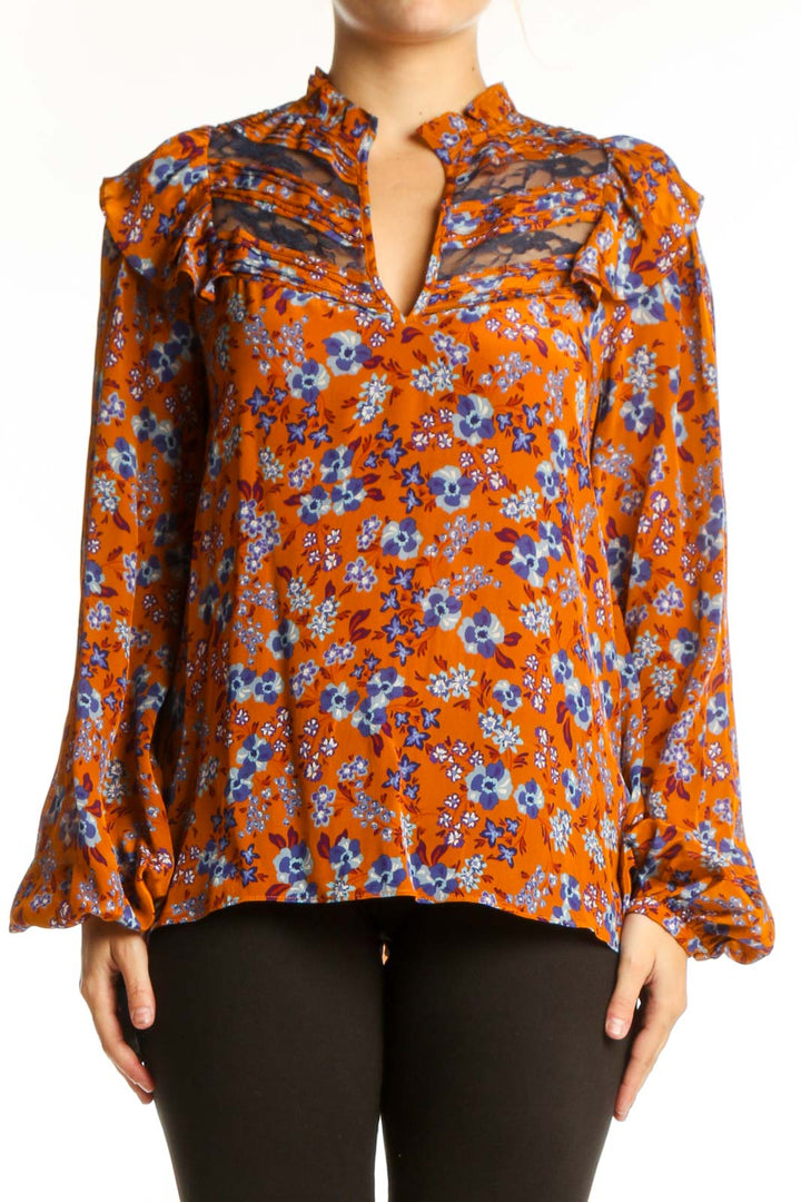 Orange floral viscose blouse with ruched shoulders, bell sleeves, and keyhole neckline by Gilner Farrar
