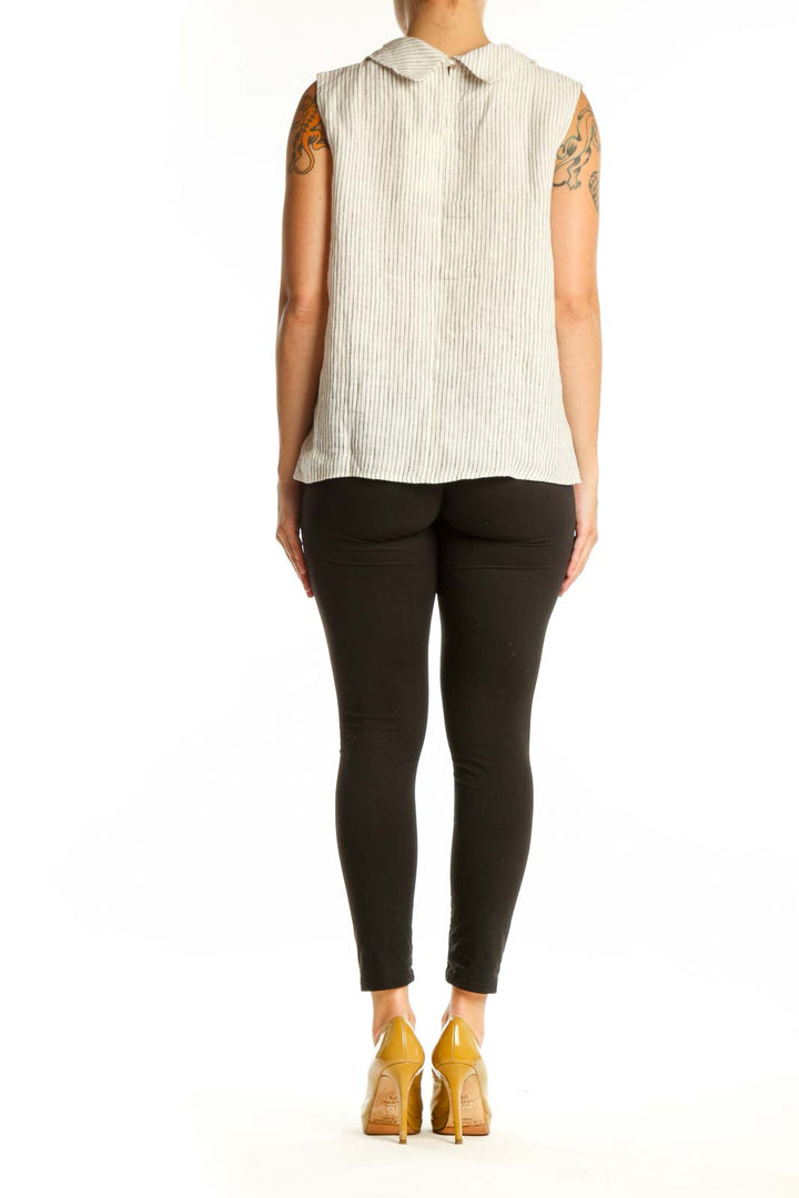 Cream linen ribbed sleeveless tank top with asymmetrical hemline, back view