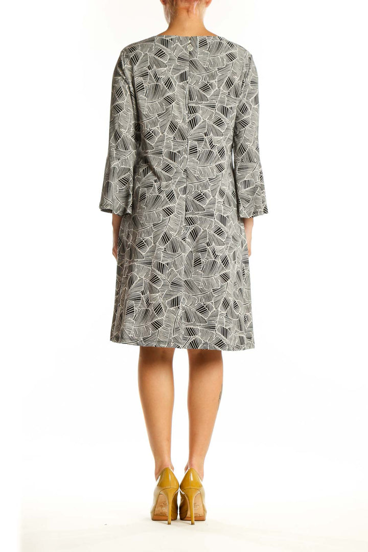 Tommy Hilfiger gray geometric print shift dress with bell sleeves, back view on model
